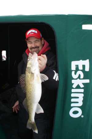 Rick Olson was on the clock for this big early ice walleye