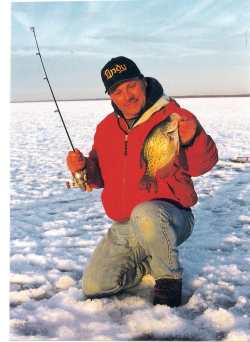 the author John Kolinski hoists a nice ice crappie