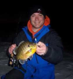 Late ice offers a great opportunity to crack giant panfish like this bull caught by Jason Mitchell Elite Series Rod angler, Tony Marrioti from Otter Tail Minnesota