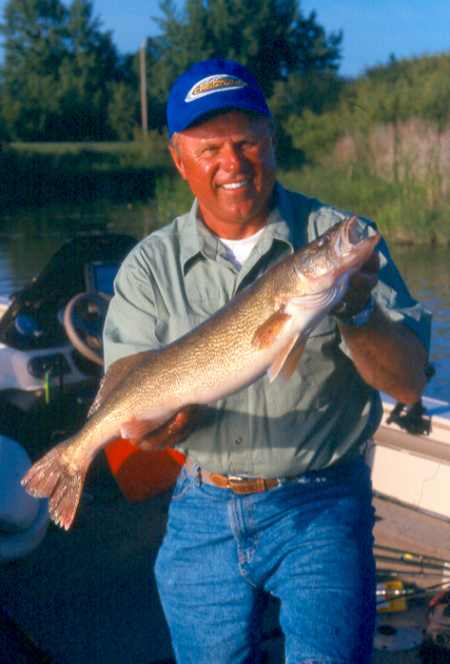 Norb Wallock with a spinner walleye