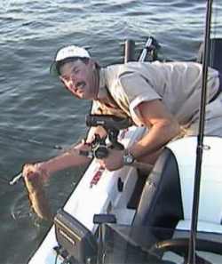 Dan Vinovich prepares to release a Crank bait walleye
